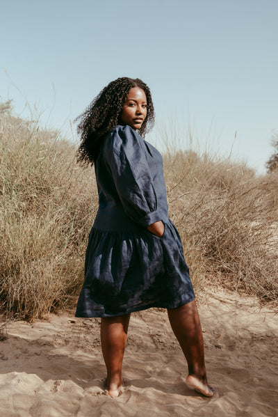 Woman wearing Aabha Italian linen dress in Navy Blue
