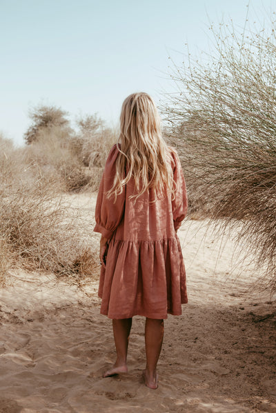 Back fetail of Aabha Italian linen dress in Brick Brown with puff sleeves