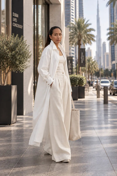 A long shirt made in organic cotton that is true to our minimalistic design and lightweight for a day at the beach or dress it up with a belt. Dubai. Sustainable Fashion.