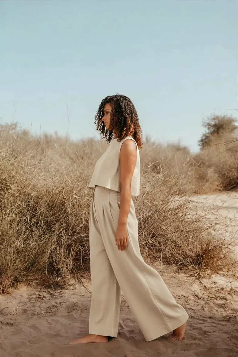 Designed and made in our Dubai studio. Pleated High-waisted Pants + Sleeveless Crop Top. Thoughtfully designed as part of our commitment to sustainable fashion and the values of modern ethical fashion brands, combining timeless style with responsible craftsmanship.