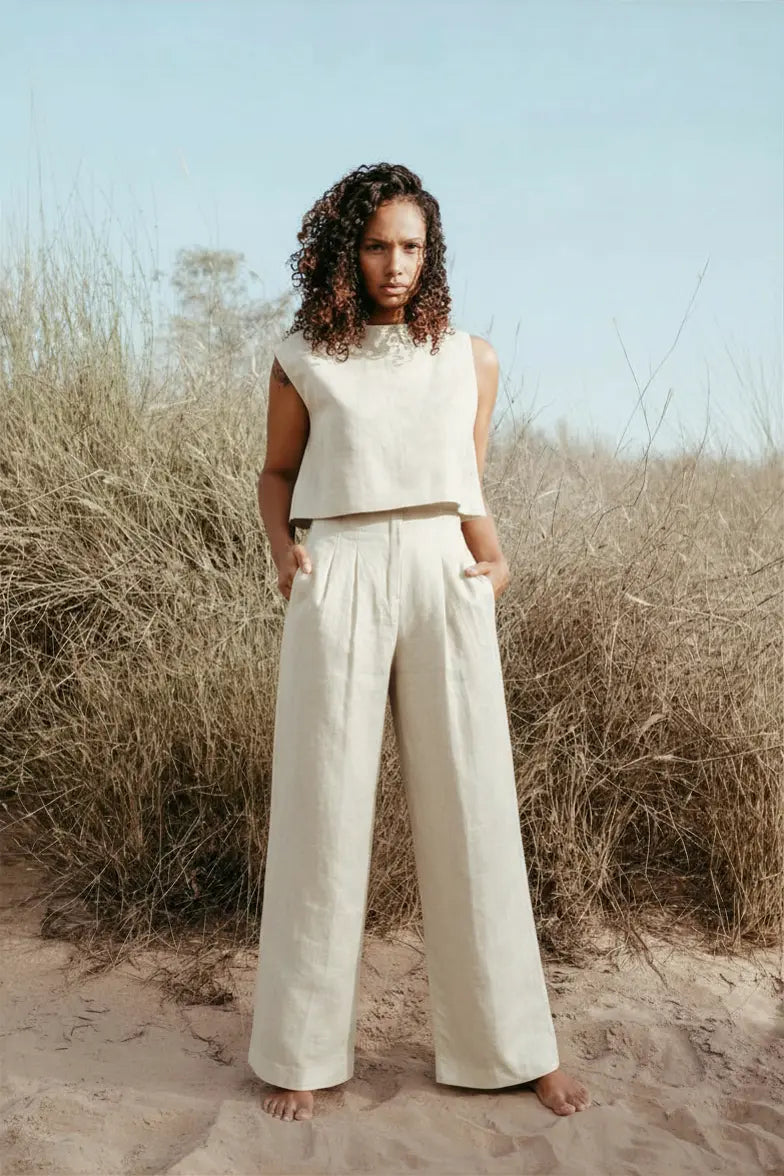 Designed and made in our Dubai studio. Pleated High-waisted Pants + Sleeveless Crop Top. Thoughtfully designed as part of our commitment to sustainable fashion and the values of modern ethical fashion brands, combining timeless style with responsible craftsmanship.