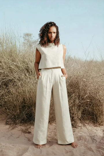 Designed and made in our Dubai studio. Pleated High-waisted Pants + Sleeveless Crop Top. Thoughtfully designed as part of our commitment to sustainable fashion and the values of modern ethical fashion brands, combining timeless style with responsible craftsmanship.