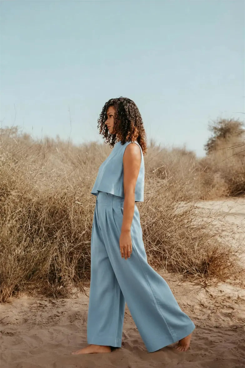 Designed and made in our Dubai studio. Pleated High-waisted Pants + Sleeveless Crop Top. Thoughtfully designed as part of our commitment to sustainable fashion and the values of modern ethical fashion brands, combining timeless style with responsible craftsmanship.