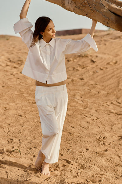 Designed and made in our Dubai studio. Pleated Low-waisted Organic Cotton Poplin Pants + Crop Full Sleeve Shirt . sustainable fashion . Ethical fashion brands.