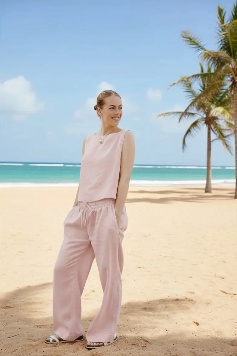 Dahlia Pants set is crafted from Italian linen and features an elasticated waist with drawstrings. Sustainably U. pastel pink.