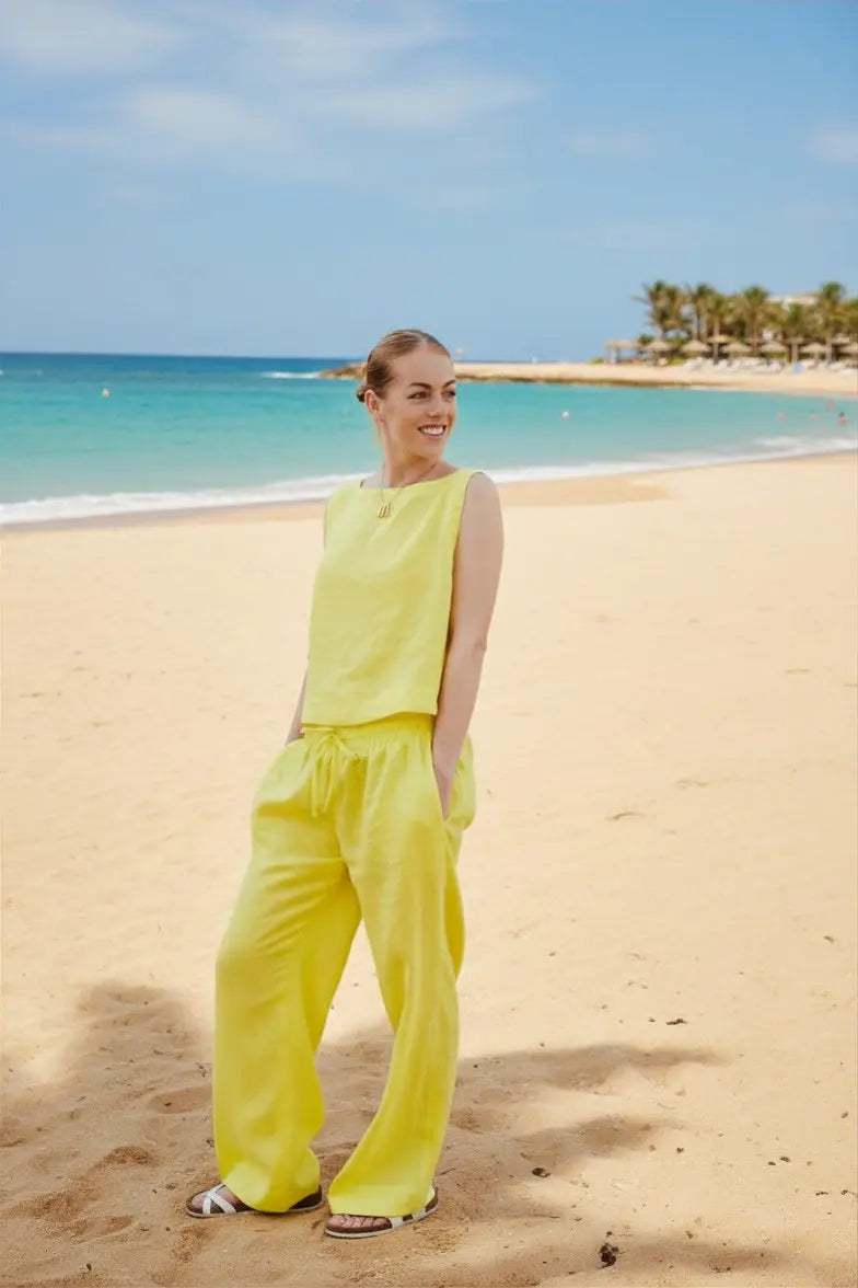Dahlia Pants set is crafted from Italian linen and features an elasticated waist with drawstrings. Sustainably U.yellow