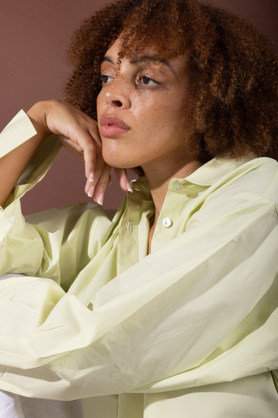 Woman wearing Isla GOTS organic cotton shirt by Sustainably U