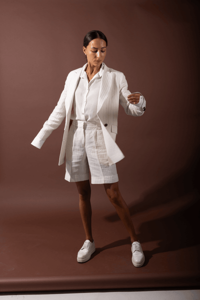Kaia off-white linen shorts styled as a summer suit