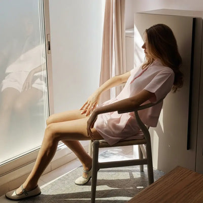 Woman wearing the Samar baby pink Italian linen crop top with matching shorts