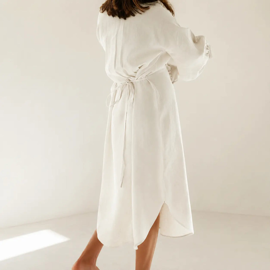 Shop the Sana lantern sleeve midi dress in 100% Italian linen. Handmade in Dubai