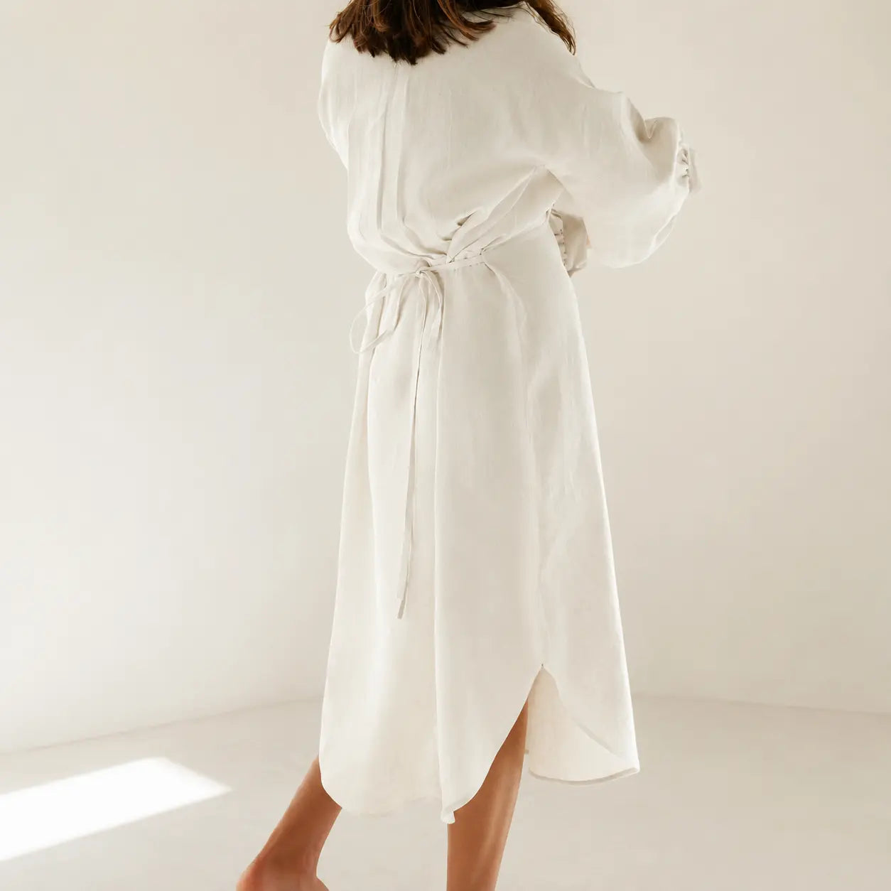 Shop the Sana lantern sleeve midi dress in 100% Italian linen. Handmade in Dubai
