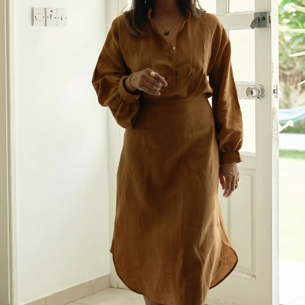 Shop the Sana lantern sleeve midi dress in 100% Italian linen. Handmade in Dubai
