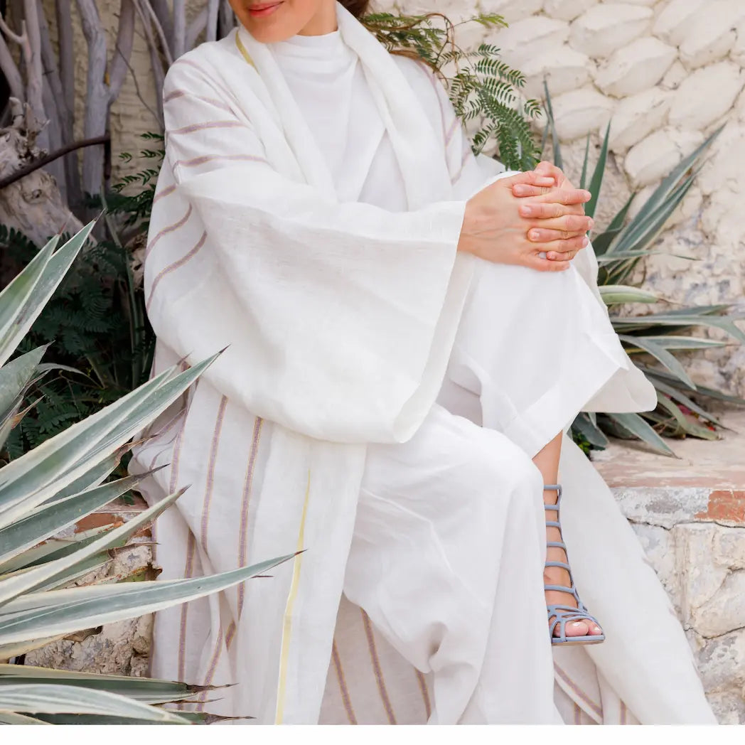 An oversized, floor-length shawl abaya crafted from premium Italian linen