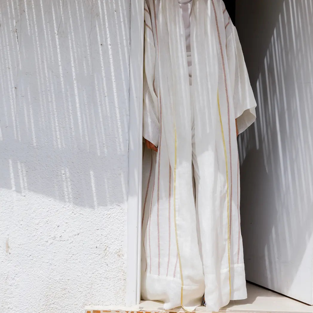 An oversized, floor-length shawl abaya crafted from premium Italian linen