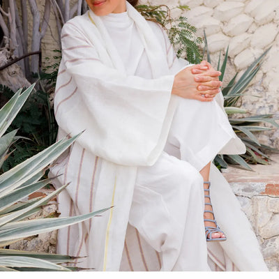An oversized, floor-length shawl abaya crafted from premium Italian linen