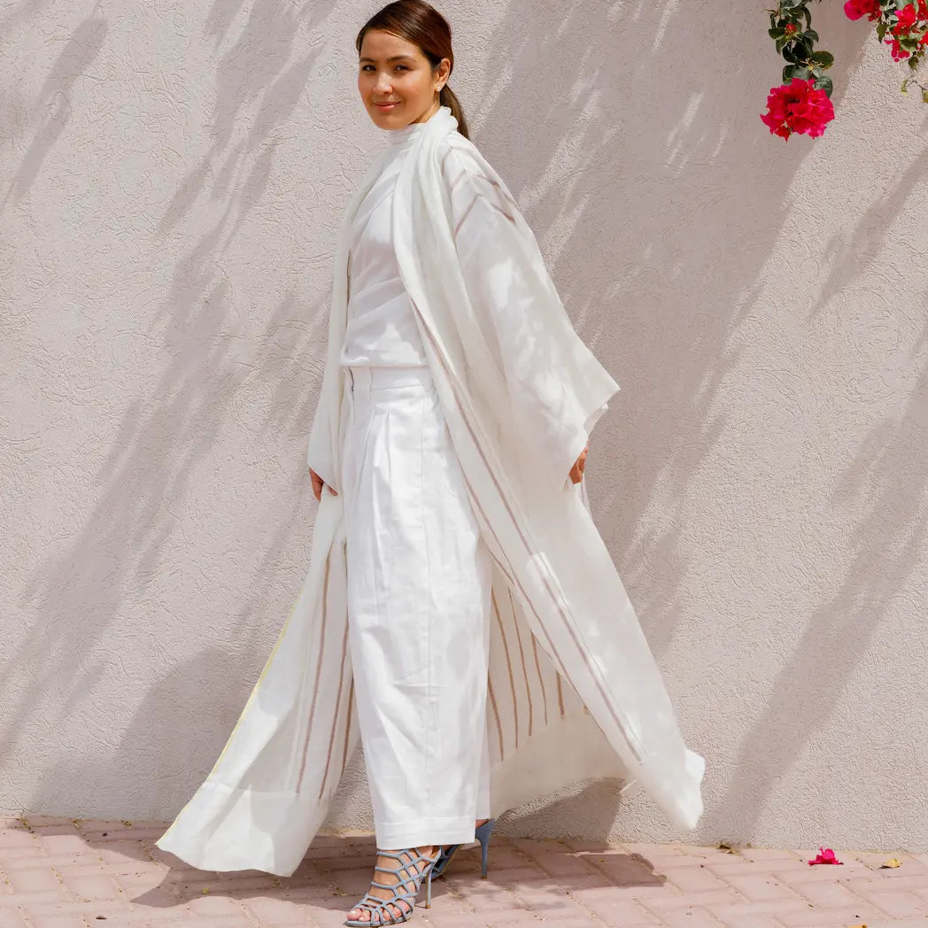 An oversized, floor-length shawl abaya crafted from premium Italian linen