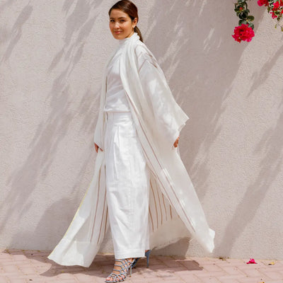 An oversized, floor-length shawl abaya crafted from premium Italian linen