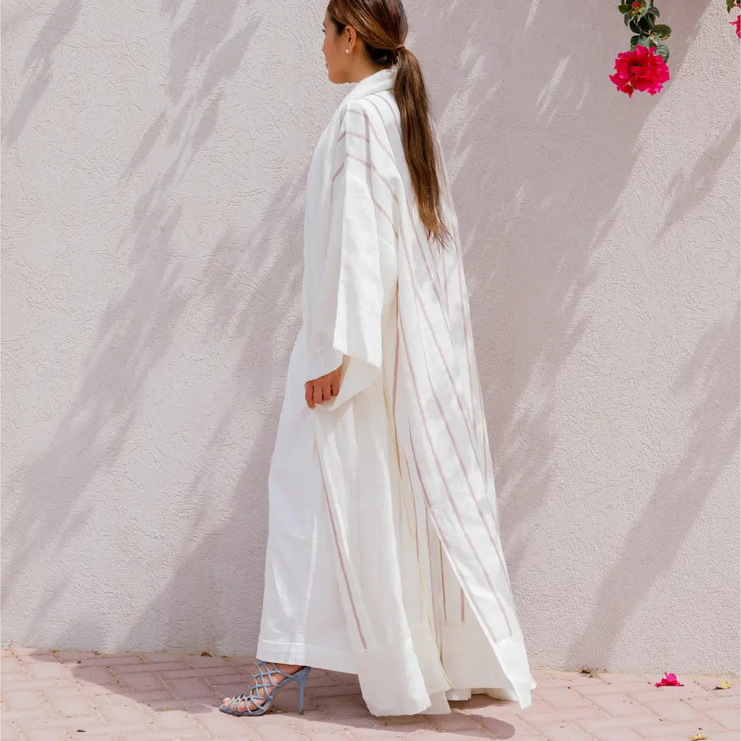 An oversized, floor-length shawl abaya crafted from premium Italian linen