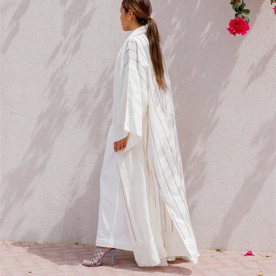 An oversized, floor-length shawl abaya crafted from premium Italian linen