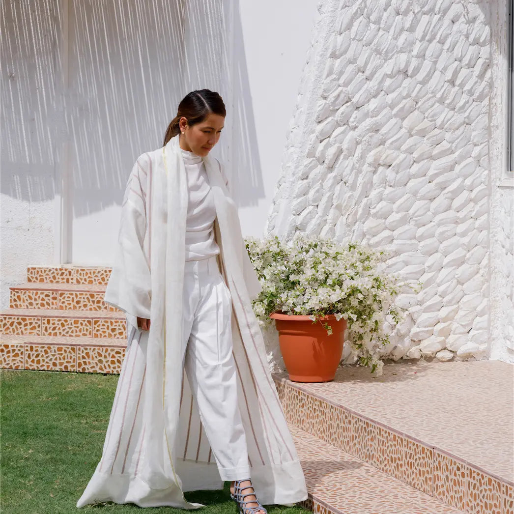 An oversized, floor-length shawl abaya crafted from premium Italian linen