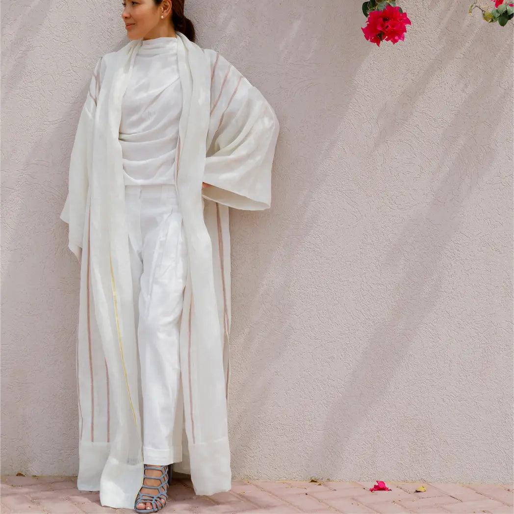 An oversized, floor-length shawl abaya crafted from premium Italian linen