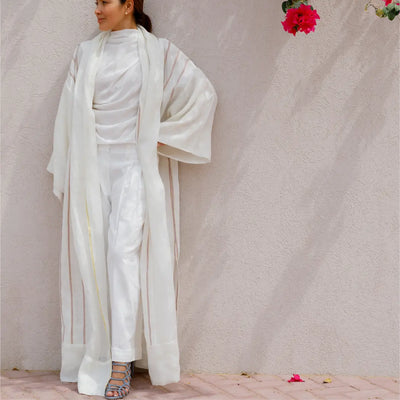 An oversized, floor-length shawl abaya crafted from premium Italian linen