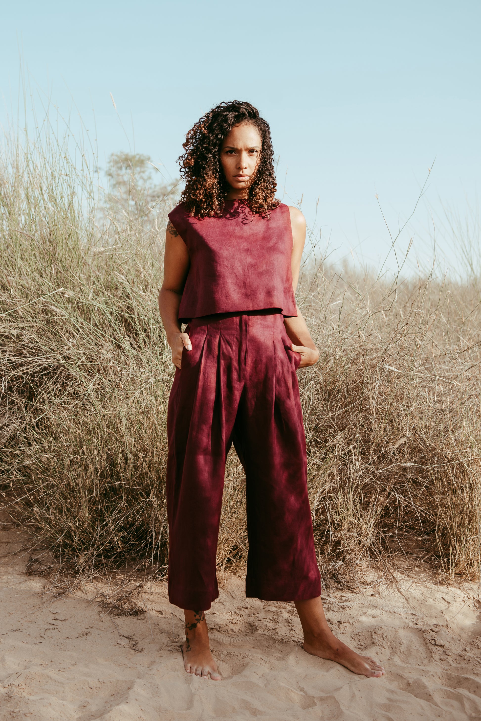 Designed and made in our Dubai studio. Pleated High-waisted Pants + Sleeveless Crop Top. Thoughtfully designed as part of our commitment to sustainable fashion and the values of modern ethical fashion brands, combining timeless style with responsible craftsmanship.