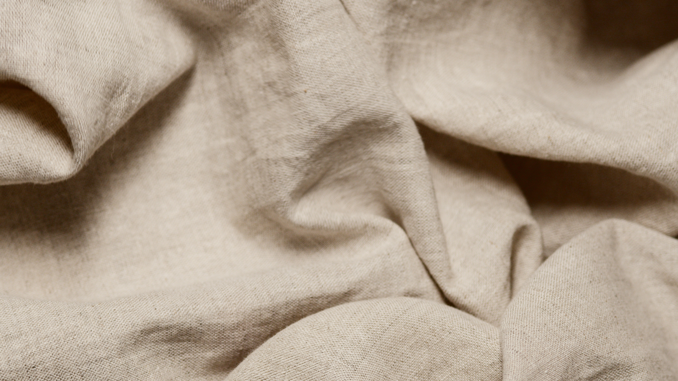 Close-up of beige fabric with folds