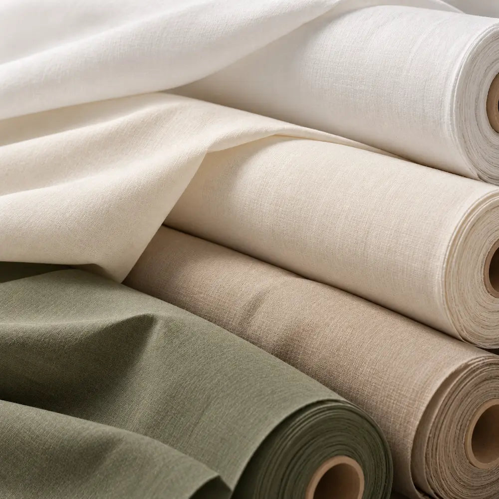 Natural fabric rolls selected for sustainable hospitality uniforms by Sustainably U in Dubai.