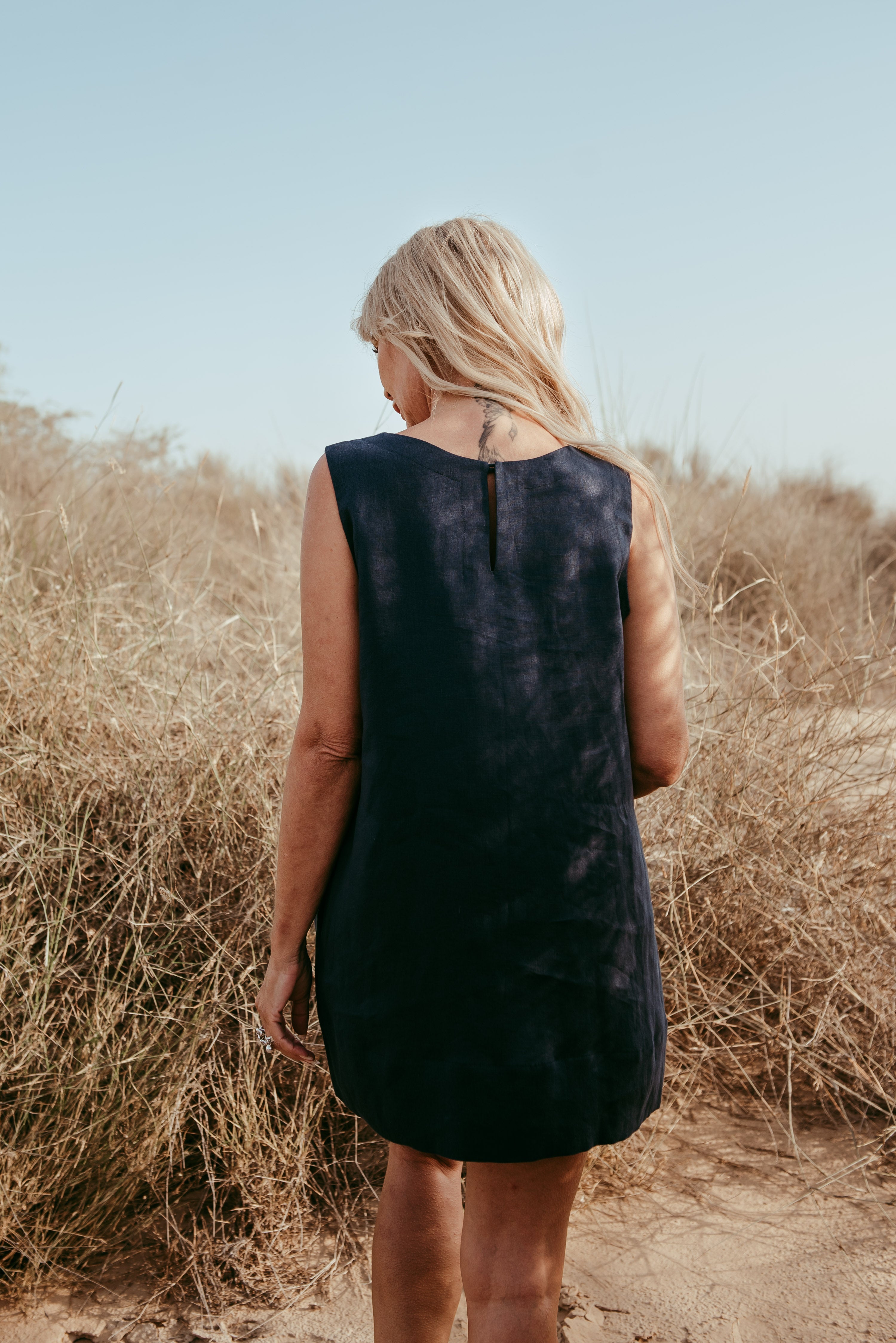sleeveless Italian linen shift dress in black. Made in Dubai. Sustainably U
